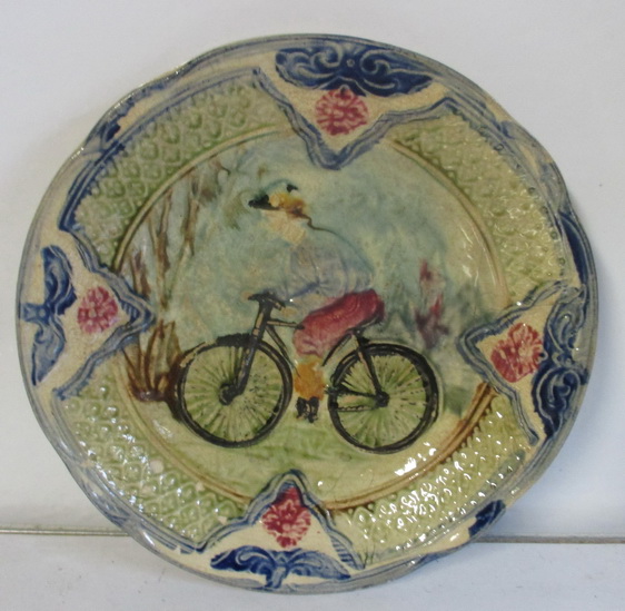 antique ceramic plate with bicycle